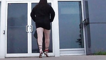 A sissy Mature CD whoring on the streets in the daylight wearing Lingerie heels panties short skirt